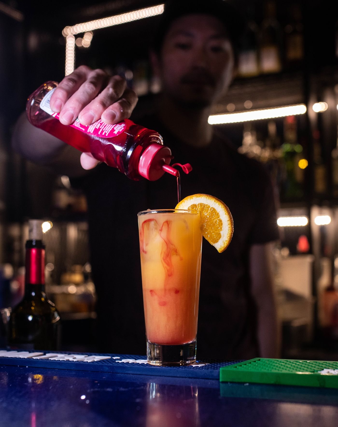 Bartender pouring a cocktail at iRock